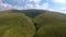 Real time - aerial view over the cows in mountain