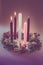 Real traditional christian religious advent wreath with 5 candles, 2 candles burning