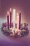 Real traditional christian religious advent wreath with 5 candles, 3 candles burning