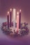 Real traditional christian religious advent wreath with 5 candles, 4 candles burning