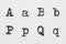 Real typewriter font alphabet with letters A, B, P, Q