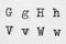 Real typewriter font alphabet with letters G, H, V, W