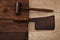 Real vintage wooden mallet and iron meat cleaver