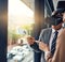 Realising their vision together. Shot of two businesspeople wearing VR headsets while working with notes on a glass wall