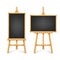 Realistic black chalkboard on wooden easel. Blank blackboard in wooden frame on a tripod. Presentation board, writing