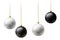 Realistic black and white Christmas balls hanging on gold beads chains on white background