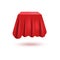 A realistic box or gift is covered with a red pleated fabric curtain.