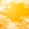 Realistic bright orange desert sky with sun, sunbeam and white clouds. Vector background