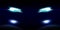 Realistic car front lights on dark background