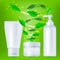 Realistic cosmetic bottles with green leafs