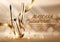 Realistic cosmetic mascara gold packaging on the shining background with bokeh