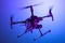 Realistic Drone Quadcopter With Camera Isolated On Bright Blue Background. Modern Videography. Side view. 3d rendering