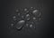 Realistic drops of water on a black background. Black background with splashing water top view. Vector illustration