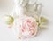 Realistic Fabric Silk flower in light pink cream and white colors rose hand made on white blurred background with angel or amur st