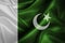 Realistic flag of Pakistan on the wavy surface of fabric