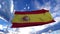 Realistic Flag of Spain waving at wind in slow with blue sky