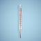 Realistic glass thermometer for measuring the temperature of the human body. Thermometer medical on light background