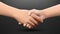 Realistic handshaking on dark background, partnership and trust concept. Vector Illustration