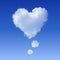 Realistic Heart shaped cloud in the blue sky.