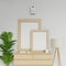 Realistic home interior 3d render of two a1 and a2 empty poster mockup template with vertical wooden frame sitting on modern