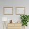 Realistic illustration of nordic apartment interior with two a2 size empty poster mock up with light wood frame hanging