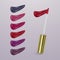 Realistic lipstick with collection of strokes of lipsticks various colors isolated on light background, vector, eps 10