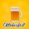 Realistic mug of beer on bright yellow orange background and hand drawn lettering Oktoberfest. Lager beer froth and bubbles. Pub