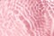 Realistic natural water wave overlay for background, blurred transparent pink colored water surface texture
