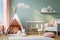 Realistic nursery with white decor, including a window and adorable cradle