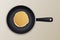 Realistic pancake in the frying pan icon closeup, top view. Design template for breakfast, food menu and homestyle