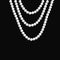 Realistic pearl necklace hangs on a dark background.