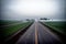 Realistic photo bird view of the empty highway through the fields in a fog