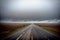 Realistic photo bird view of the empty highway through the fields in a fog