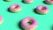 Realistic pink donuts minimalistic cover footage able to loop seamless