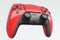 Realistic red video game joystick or gamepad on white background