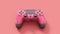 Realistic red video game joysticks or gamepads on pink background