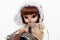 Realistic redhead doll with hood portrait in winter clothes