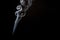 Realistic shot of a wisp of smoke against a black background - great for a cool background