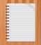 Realistic spiral notepad notebook on wood vector, Paper sheet