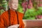 Realistic statue of a full-length Buddhist monk in a Thailand temple