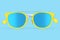Realistic sunglasess with gradient lens and blue plastic frame on blue