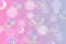 Realistic water bubbles in transparent gradient pastel color background,