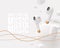 Realistic white portable wireless headphones with golden elements and charging case, 3d render wireless Earbuds.