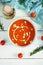 Ð¡ream soup of tomatoes and pepper. Hot tomato soup in bowl. Top view