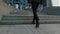 Rear back view feet of businessman commuting to work. Confident guy in leather shoes and suit being on his way to office