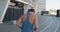 Rear back view of handsome sport man running outdoors. Portrait of running man jogging at stadium. Sport workout outdoor