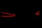 Rear car lights on a black background. Cars light trails. Night city road with traffic headlight. Light up road by vehicle. Car li