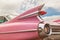 Rear end of a classic pink Cadillac fifties car