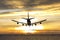 Rear image commercial passenger aircraft or cargo transportation airplane fly over coast of sea after takeoff from airport in