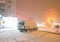 Rear lights of car on backyard in dark foggy winter night